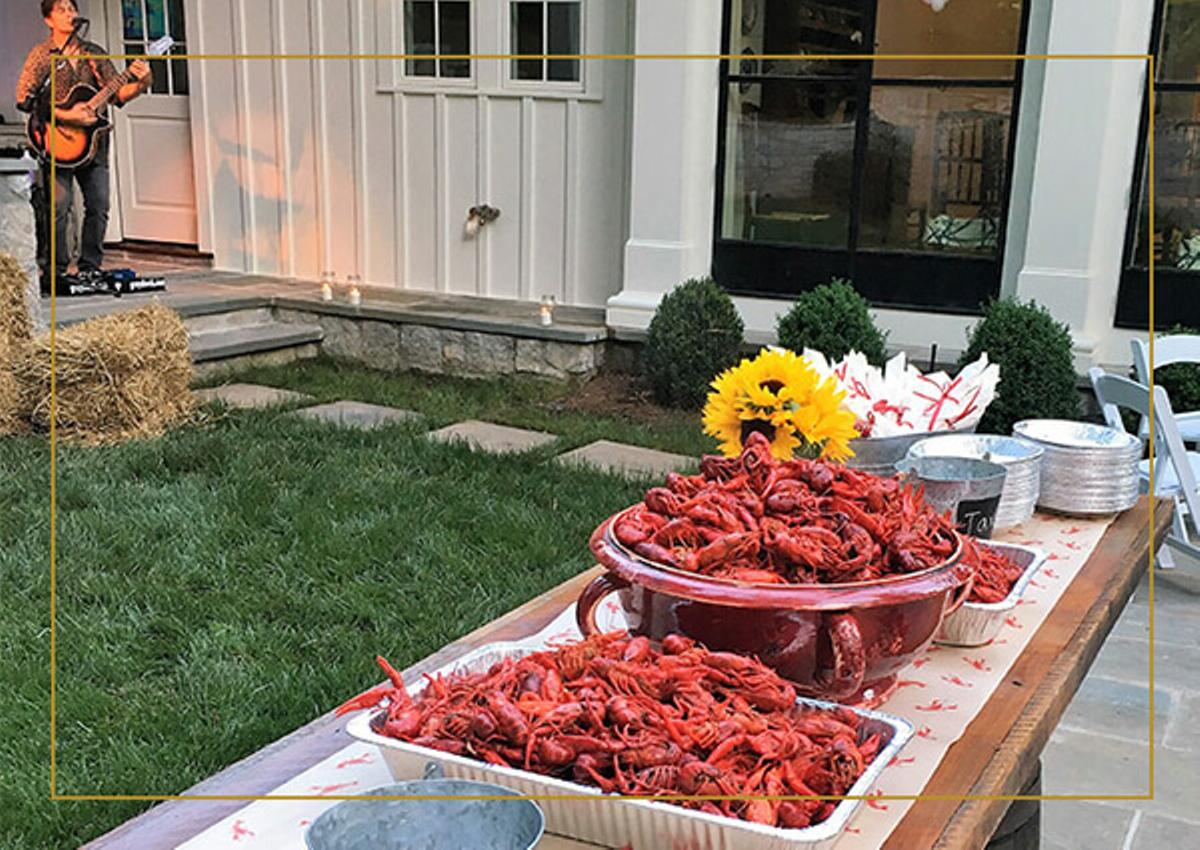 An outdoor table with fresh cooked crawfish